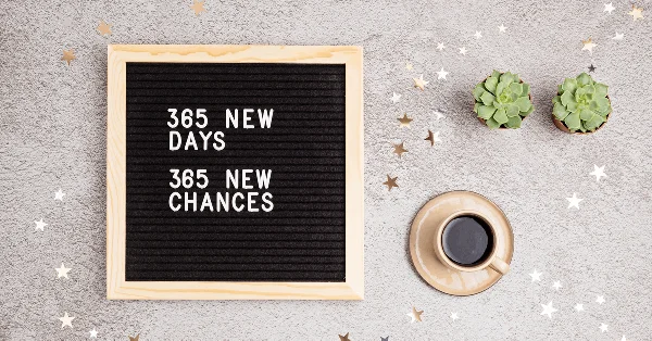 A reminder board with 365 new days and 365 new chances stuck on
