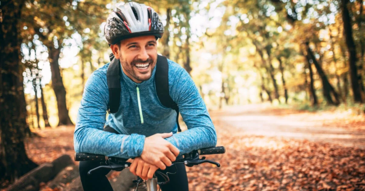 a professional mountain biker smiling