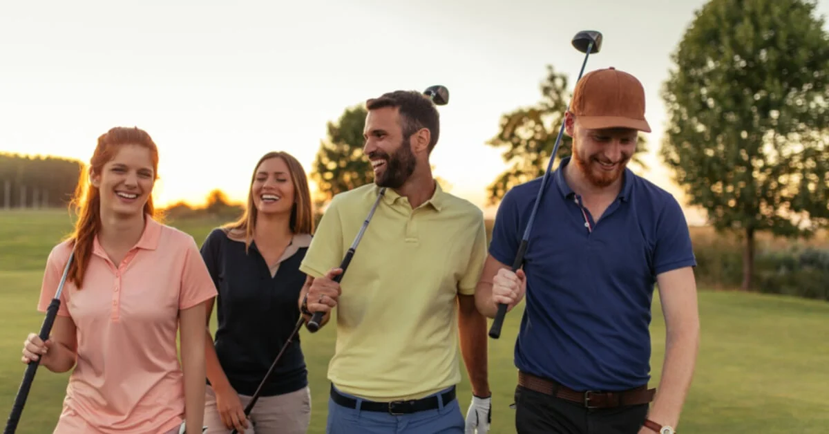 a group of friends laughing and playing golf