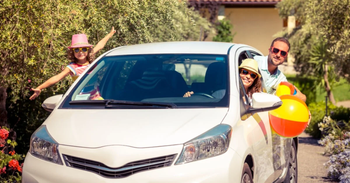 family getting in the car to go on holiday