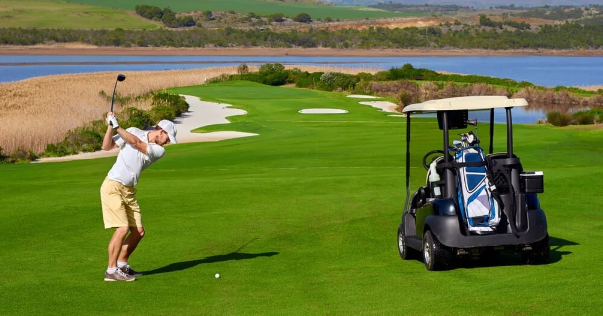 a man on a beautiful sunny golf course