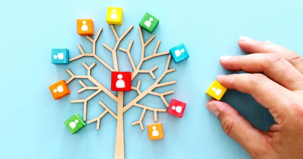a wooden tree with icons symbolising people