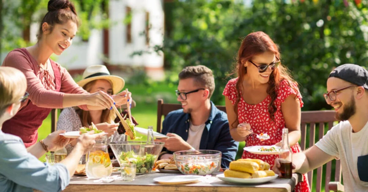 friends eating food in the garden