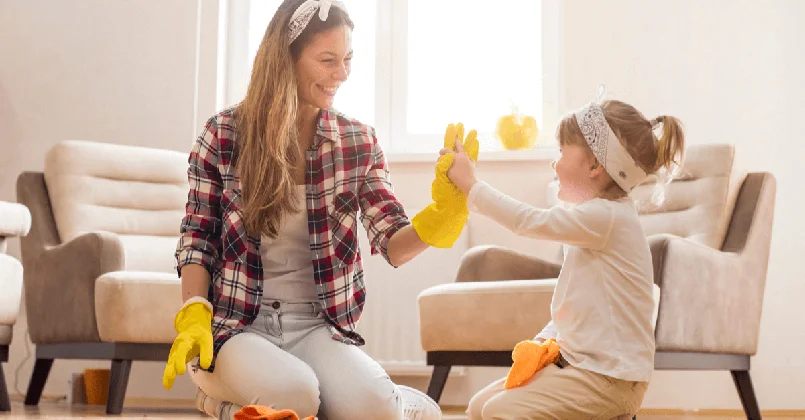 Cleaning mum and daughter high five