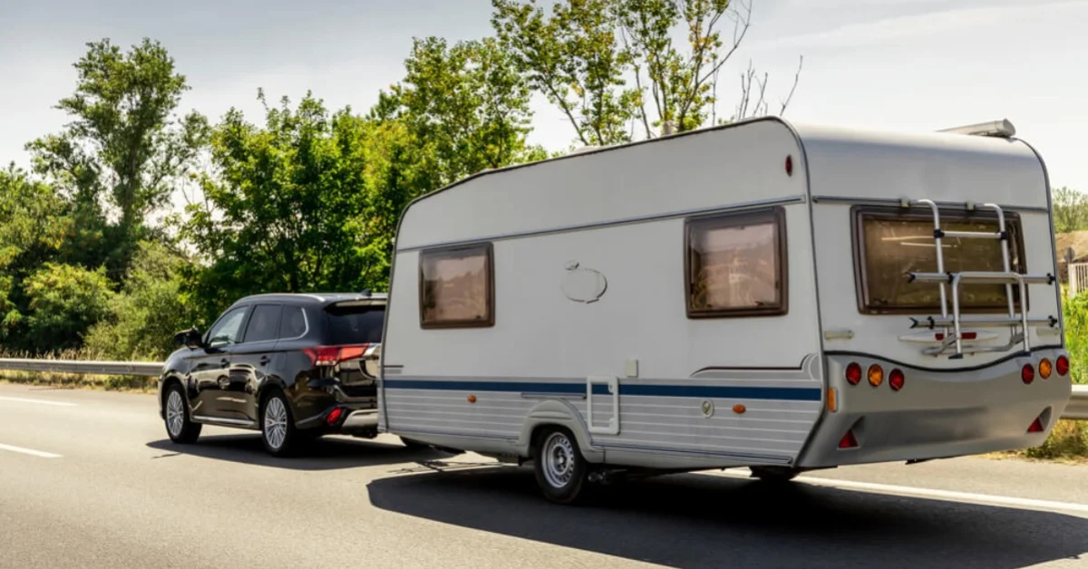 a 4 wheel drive car towing a caravan