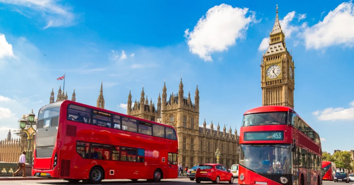 big ben in london behind a red double-decker bus