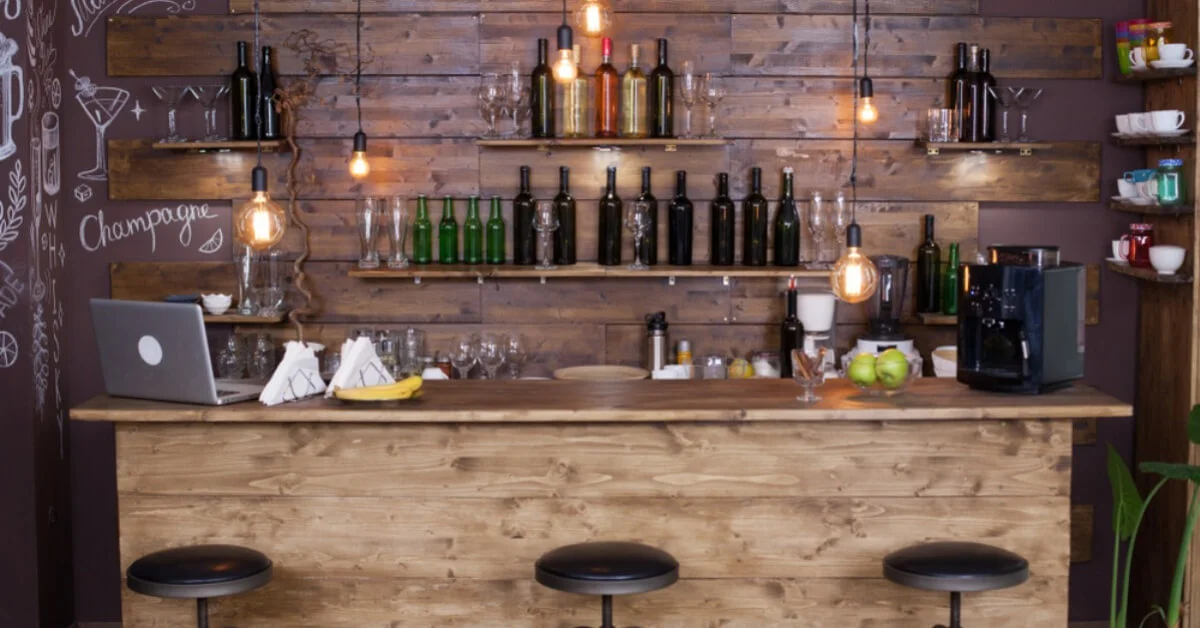 a home bar with wooden pannelling